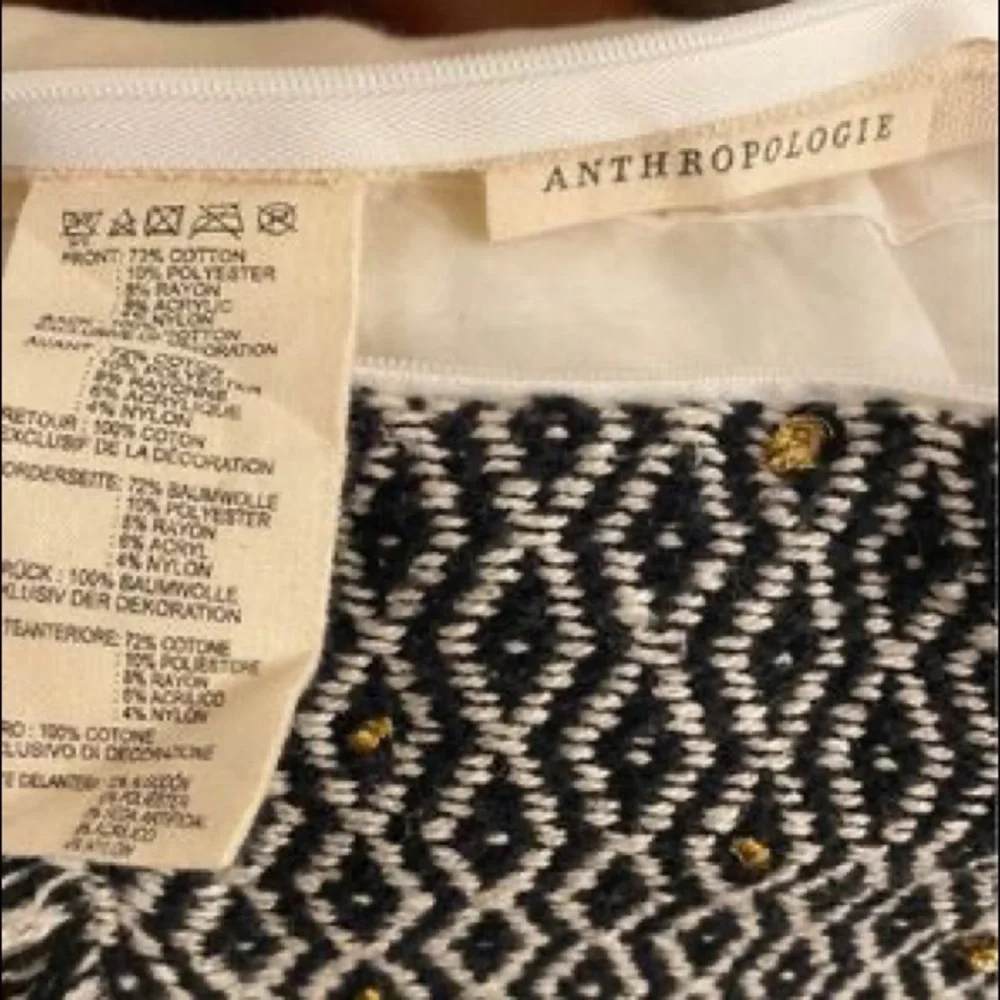 Anthropologie | Tasseled Retrograde Pillow Black Ivory Gold Embroidered